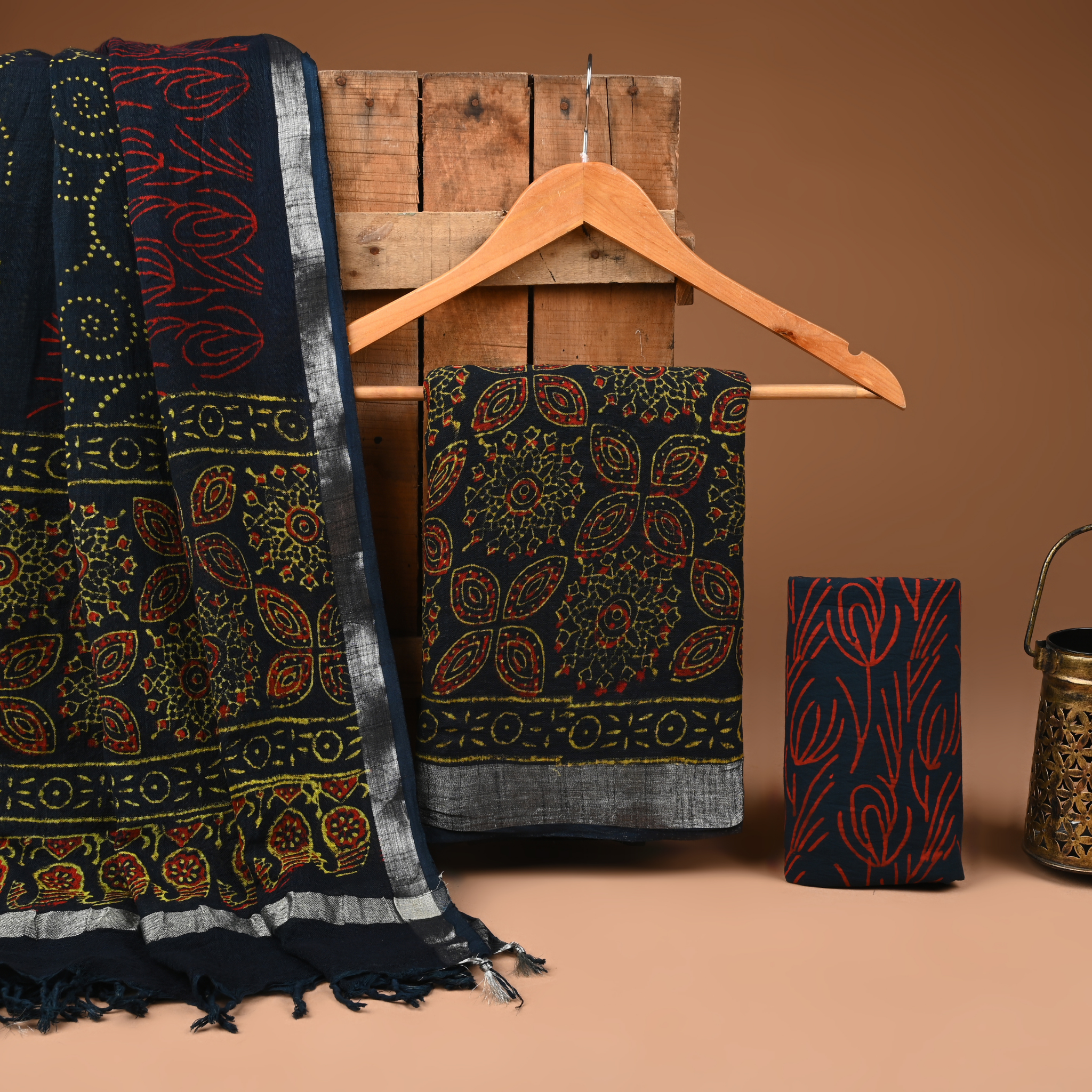 Patterned fabric on a wooden hanger against a brown background